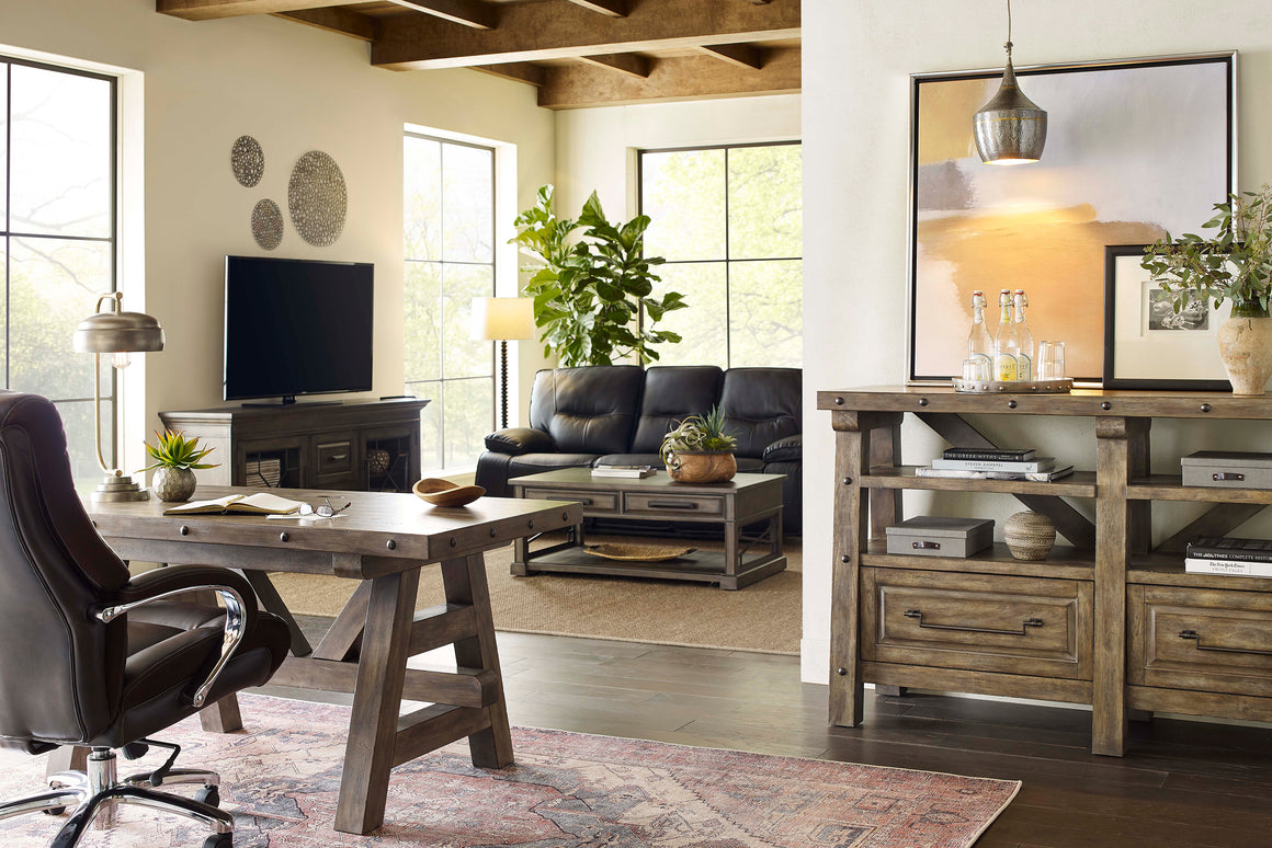 Lodge collection home office furniture in a home with a dark sofa in the background.